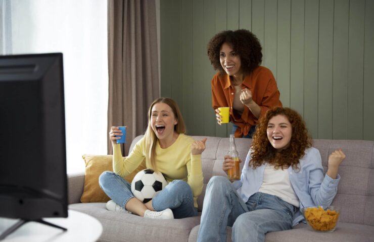 group-female-friends-home-watching-sports-together (1)